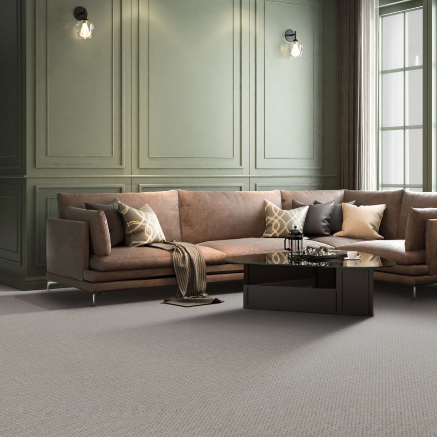 green walls, brown couch, pillows